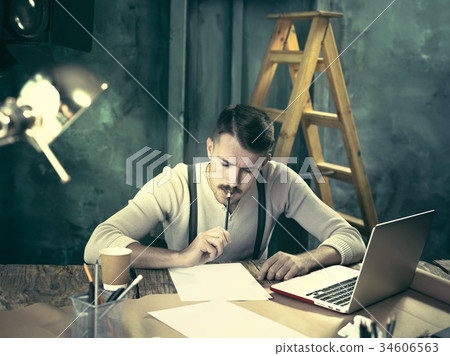 Portrait of a bearded businessman who is working 34606563