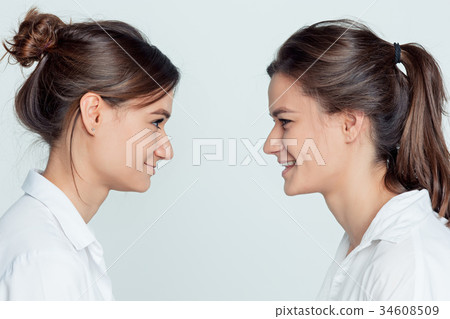 Studio portrait of female twins 34608509