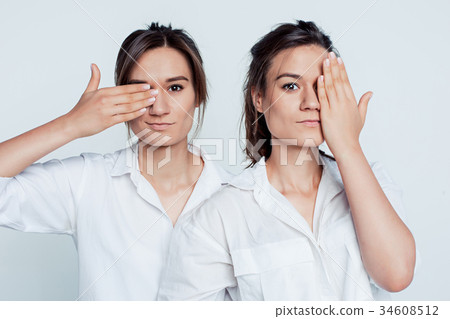 Studio portrait of female twins 34608512