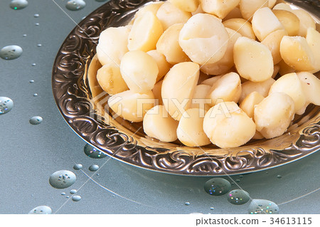 Macadamia nuts on plate Macadamia nuts on plate 34613115