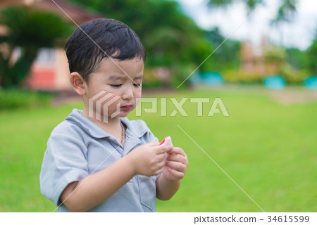 Little Asian kid at the playground under sunlight 34615599