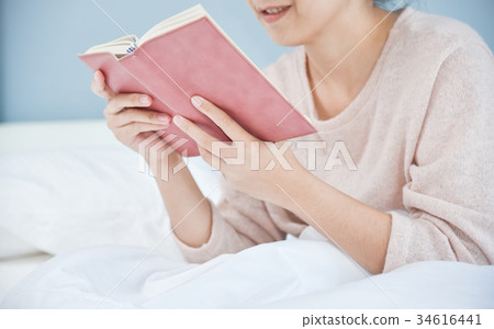Happy Beautiful Asian woman reading book. 34616441