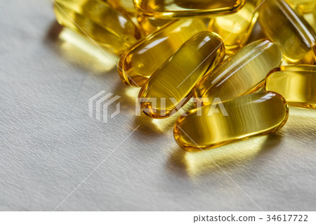 Fish oil supplement, medical and health concept Fish oil supplement, medical and health concept 34617722