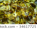 Fish oil supplement, medical and health concept 34617725