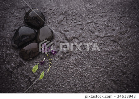 black stone with green leaf  34618948