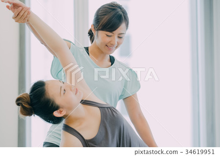 Young woman doing yoga in yoga studio Young woman doing yoga in yoga studio 34619951