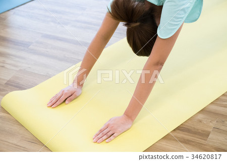 Young woman doing yoga in yoga studio 34620817