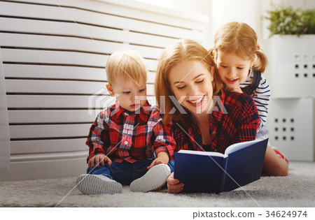 Mother reads book to children Mother reads book to children 34624974