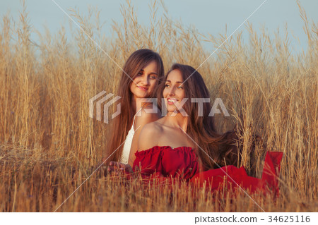 Joyful women in the field. Joyful women in the field. 34625116