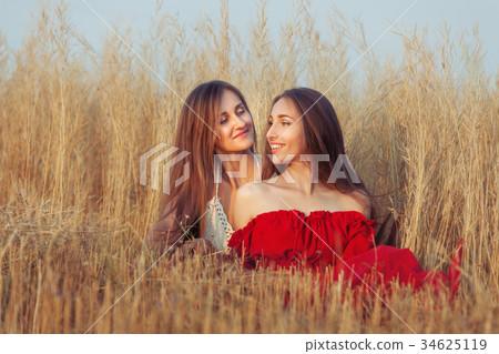 There are two women in the field. 34625119