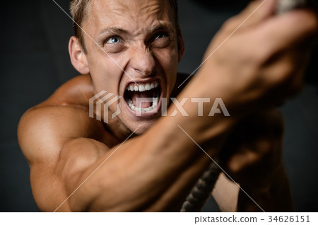 Handsome model young man working out in gym Handsome model young man working out in gym 34626151