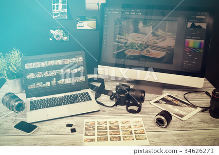 Photographers computer with photo edit programs. 34626271