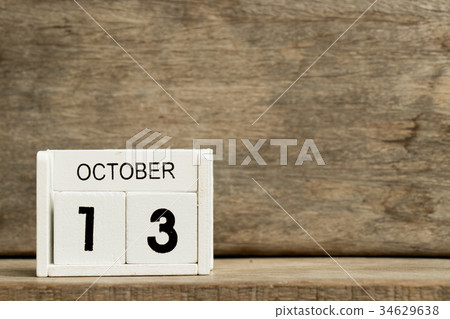 White block calendar present date 13 and October 34629638
