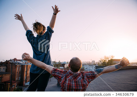 Freedom life. Happy free couple on roof Freedom life. Happy free couple on roof 34630679