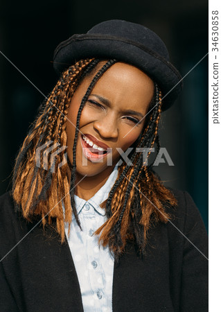 Seductive smirking black female. Playful mood Seductive smirking black female. Playful mood 34630858