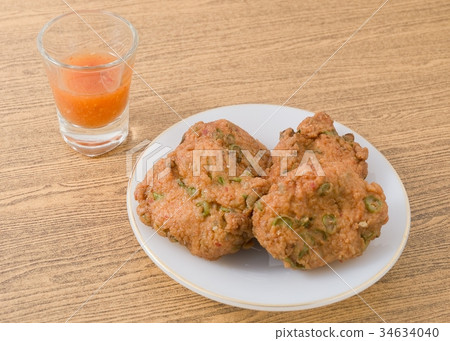 Thai Fish Cakes Served With Sweet Spicy Sauce Thai Fish Cakes Served With Sweet Spicy Sauce 34634040