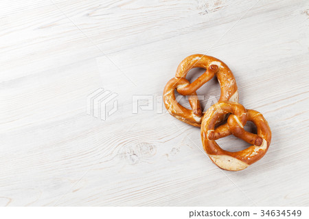Pretzel. Beer snacks on wooden table Pretzel. Beer snacks on wooden table 34634549