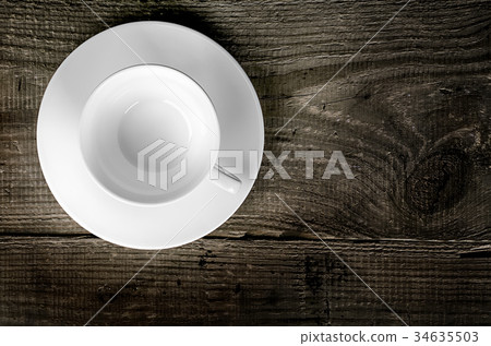 Empty coffee cup on wooden table 34635503