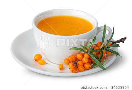 Juice from sea-buckthorn in a cup with berries Juice from sea-buckthorn in a cup with berries 34635504
