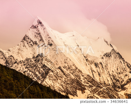 High mountain peak covered with fog 34636641