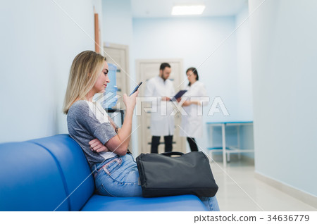 Female Patient Being Reassured By Doctors In 34636779