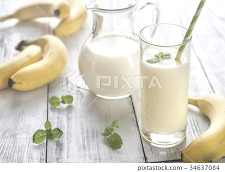 Glass of banana milk shake Glass of banana milk shake 34637084