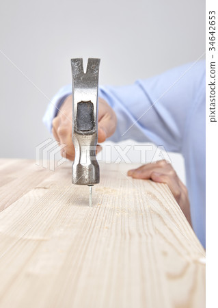 Hand, nail, hammer 34642653
