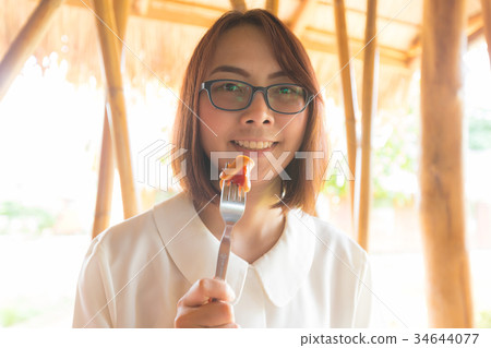Woman eatting breakfast. Woman eatting breakfast. 34644077