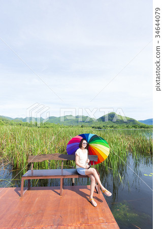 Woman sitting at the bench Woman sitting at the bench 34644079