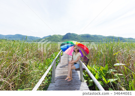 Woman sitting at the bench Woman sitting at the bench 34644081