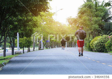 Athletic man running in park. Healthy lifestyle 34644356