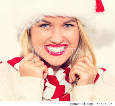 Happy young woman with Santa hat 34645296