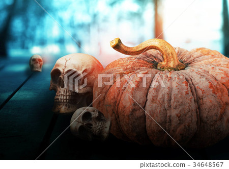 Pumpkin and skull on wooden. Pumpkin and skull on wooden. 34648567