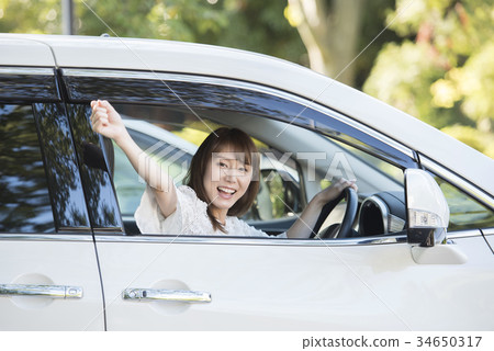 Young woman leaving for a drive Young woman leaving for a drive 34650317