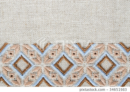 Slavic cross stitch by brown and beige threads. Slavic cross stitch by brown and beige threads. 34651983