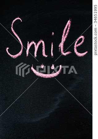 Inscription Smile on a Dark Background. 34651995