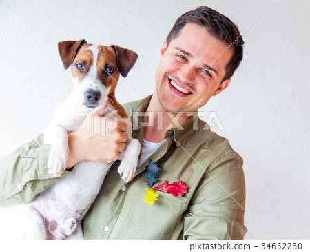 Handsome man with dog and oak leaves 34652230