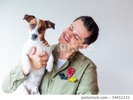 Handsome man with dog and oak leaves 34652231