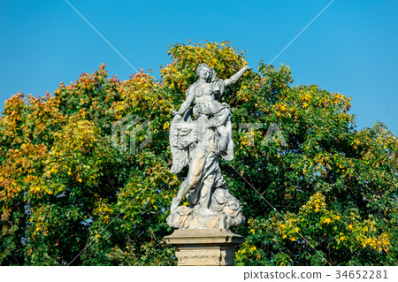 Classic statue in a park with blue sky  34652281