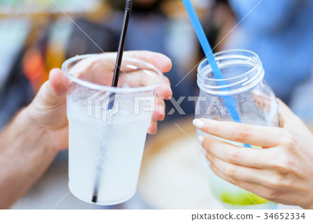 Drinking lemonade cocktail 34652334