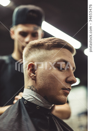 Anonymous barber preparing client 34653476