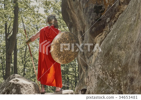 Strong man posing in warrior armor Strong man posing in warrior armor 34653481