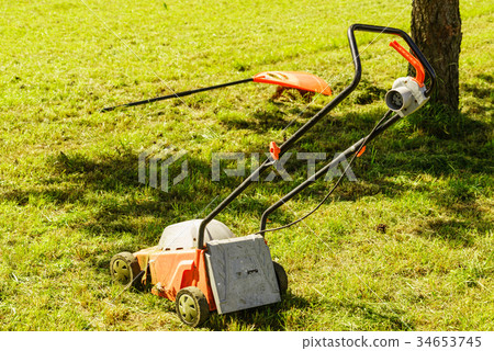 Gardening. Mowing lawn with lawnmower 34653745