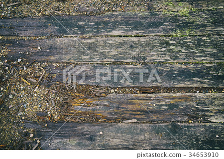 Decayed wooden boards of old river bridge 34653910