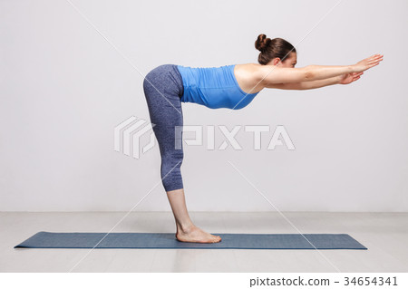 Woman doing yoga 34654341