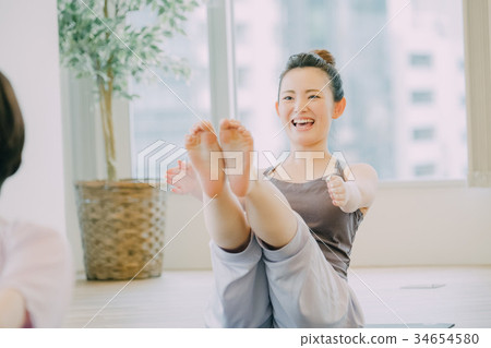 Young woman doing pilates Young woman doing pilates 34654580
