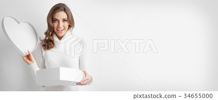 Woman open heart shaped box 34655000