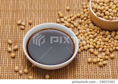 Soy sauce and soy bean on wooden table Soy sauce and soy bean on wooden table 34655462