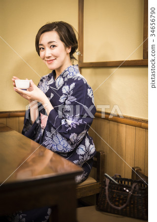 Woman in yukata drinking tea Woman in yukata drinking tea 34656790