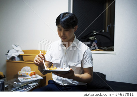 Men eating lunch in the room 34657011